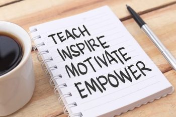 Teach inspire motivate empower, text words typography written on paper against wooden background, life and business motivational inspirational concept